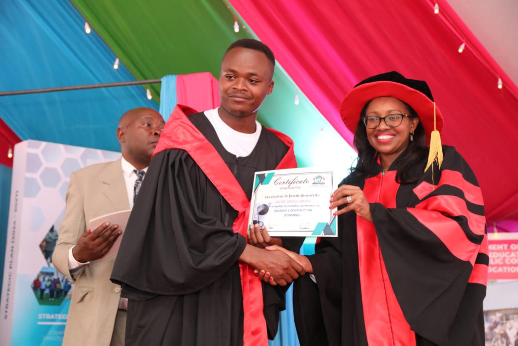 VTC Governor Susan Kihika present a certificate graduation ceremony